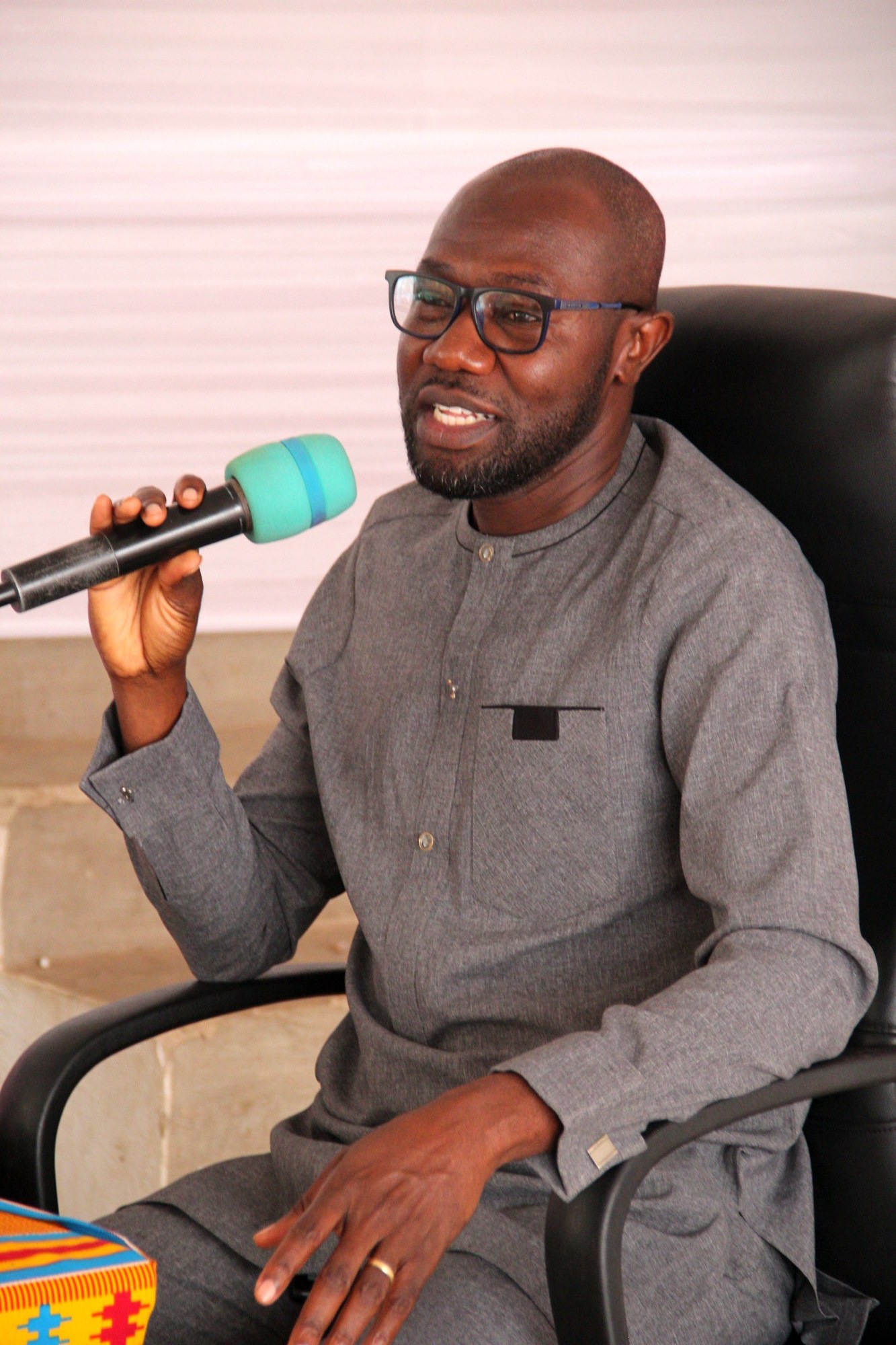 Guest speaking into a microphone at the launch