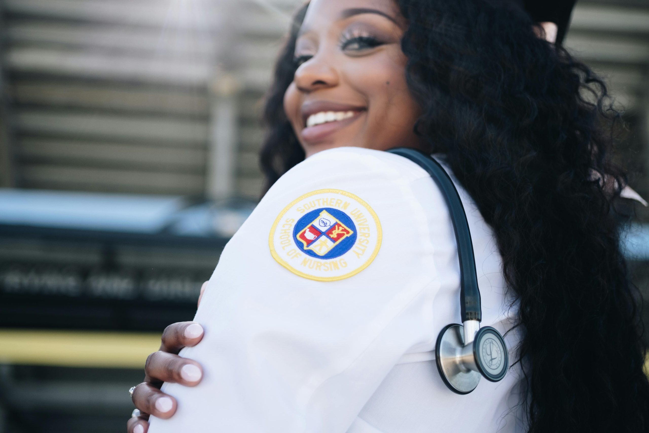 Happy nurse with stethoscope outdoors, showcasing joyful and professional spirit